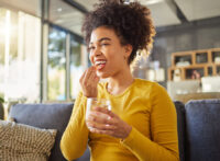 Woman taking a pill