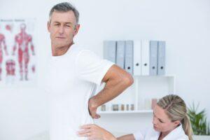 doctor examining patient's back