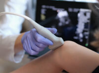 Ultra sound being performed on a knee