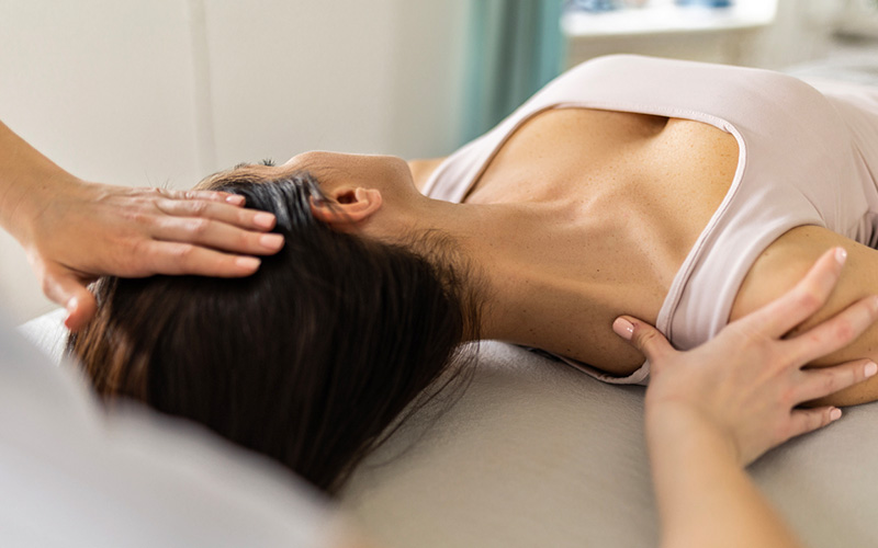 chiropractor stretching a woman's neck