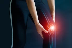 Man holding knee in pain